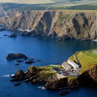 an aerial view of the cliffs and coastline at Hartland Quay Hotel