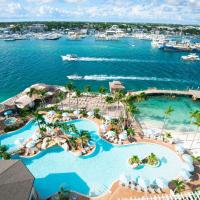 an aerial view of a resort with a marina at Warwick Paradise Island Bahamas - All Inclusive - Adults Only, Nassau