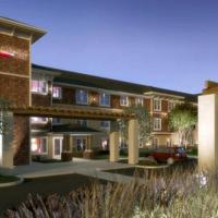 a rendering of a apartment building with a parking lot at Ledgestone Hotel, Yakima