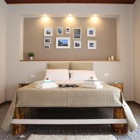 a bedroom with a large bed with two pillows at I3Mori, Barcellona-Pozzo di Gotto