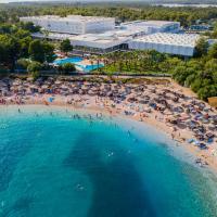 an aerial view of a beach with people and umbrellas at Amadria Park Ivan, Šibenik