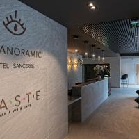 a lobby of a hotel with a hotelenna sign on a wall at Le Panoramic, Sancerre