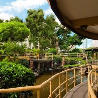 a view of a park with a river and trees at Pagoda Hotel, Honolulu
