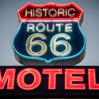 a neon sign for aroute motel at Historic Route 66 Motel, Seligman