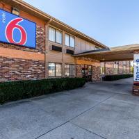 a building with a sign on the side of it at Motel 6-Troy, IL