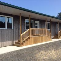 a building with a porch and stairs on it at Farm Retreat with 2 Bed Roms perfect for 4 Guests!, Deep Brook