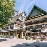 a building with flowers on the side of it at Hotel - Landgasthof Rebstock, Nimburg
