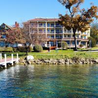 a building next to a body of water at Bella Vista Suites Lake Geneva