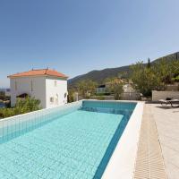 a swimming pool with a view of a villa at Beautiful Villa in Agia Paraskevi Samos with Private Swimming Pool, Agía Paraskeví