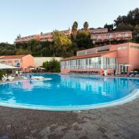 a large swimming pool in front of a building at Panorama Sidari