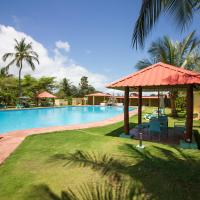 a swimming pool at a resort with a resort at Hotel Praia, São Tomé