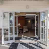 an open door of a house with a living room at MainStay Suites Coralville - Iowa City
