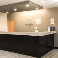 a lobby with a counter with a sign on the wall at Quality Inn & Suites Lincoln near I-55