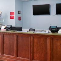 a reception desk with two fax machines on top of it at Econo Lodge Inn & Suites South Sandusky