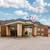 a building with two flags on top of it at Comfort Inn & Suites Shawinigan