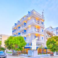 a large white building with trees in front of it at Dias Hotel, Alexandroupoli