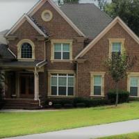 a brown brick house with at Elegant Jewel, Lithonia
