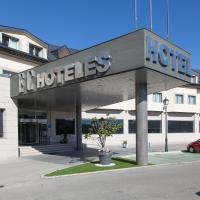 a building with a sign for a hotel at Hotel FC Villalba, Collado-Villalba