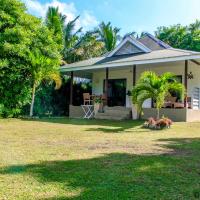 a small house with a yard in front of it at Surf Tropical Villa Takamaka, Cerf Island