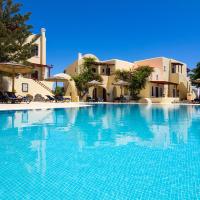 a large swimming pool in front of a villa at Smaragdi Hotel, Perivolos