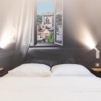 a bedroom with two beds and a window at B&B Hôtel Avignon (2), Le Pontet