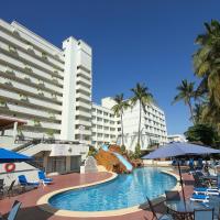 a hotel with a swimming pool with chairs and umbrellas at Don Pelayo Pacific Beach, Mazatlán