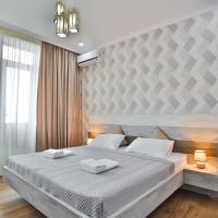 a bedroom with a large bed in a room at Hotel Terrace Kutaisi