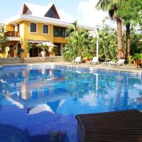a large swimming pool in front of a house at Casa Las Palmas Hotel Boutique, San Andrés