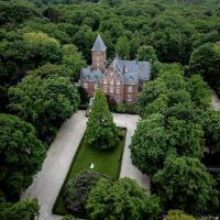 an aerial view of a castle in the middle of a forest at Kasteel de Wittenburg, Wassenaar
