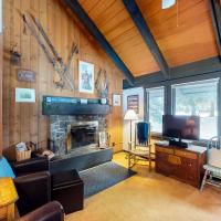 a living room with a couch and a fireplace at Yellowstone 28B, Big Sky