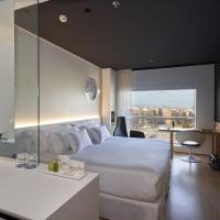 a hotel room with a bed and a sink at Barceló Sants, Barcelona