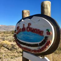 a sign for a dog surfing restaurant in the desert at Lo de Susana privado, Los Antiguos