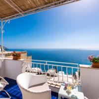 a balcony with chairs and a view of the ocean at Casa Guadagno, Positano