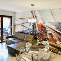 a living room with a large painting of a boat at Willa Stornia, Jastarnia