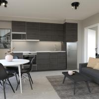 a living room with a couch and a table at Naantali City Apartments