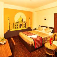 a hotel room with a bed and a table at Kathmandu Eco Hotel