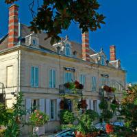 an old house with three chimneys on top of it at Hotel Henri IV, Coutras
