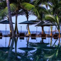 a pool with chairs and umbrellas and palm trees at Hikka Sandy Pearl Beach Resort, Hikkaduwa