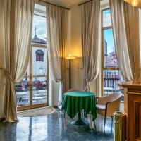 a room with a table and chairs and a window at Hotel San Donato - Bologna centro