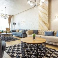a living room with couches and a table at City Avenue Hotel by HMG, Sofia