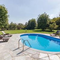 a swimming pool with lounge chairs and a patio at Villa Girasole, Incisa Scapaccino