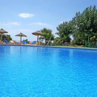 a large blue swimming pool with chairs and umbrellas at Finca Son Guardiola, Llucmajor