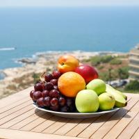 a plate of fruit on top of a table at Rawsheh 51, Beirut