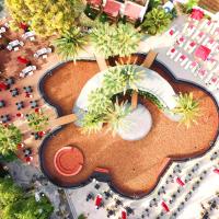 an aerial view of a resort with a pool and palm trees at Otium Senses Very Chic Bodrum Adult Only, Gümbet
