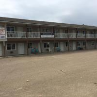 Kacee's Northern Suites, отель рядом с аэропортом Fort Nelson Airport - YYE в городе Форт-Нельсон