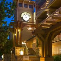 a building with a clock on the side of it at Toll House Hotel Los Gatos