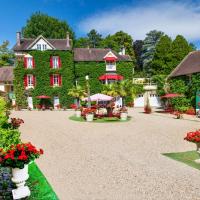 a large green building with red windows and flowers at Manoir des Cavaliers - BnB, Chantilly