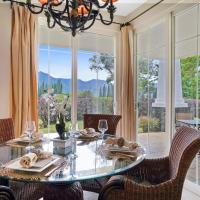 a dining room with a glass table and chairs at Plantations at Princeville #512