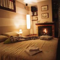 a bedroom with a bed with a fireplace at ALLEGRETTI'S HOUSE VENOSA, ospitalità e accoglienza, Venosa