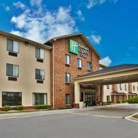 a hotel with a sign on the front of a building at Holiday Inn Express & Suites Buford NE - Lake Lanier Area, an IHG Hotel